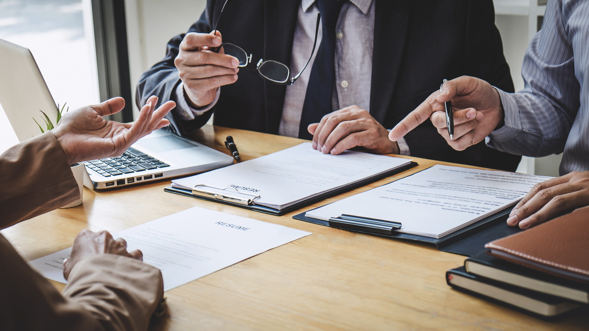 Business woman explaining about his profile to two selection committee manager sitting in during job Interview, interview the job and hiring