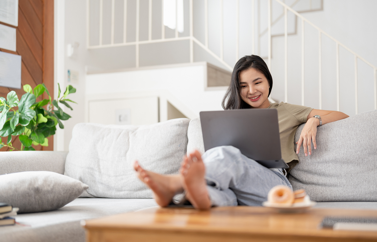 Young asian woman having conversation chatting while using laptop at house. Work at home, Video conference, Online meeting video call, Virtual meetings, Remote learning and e-learning